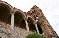 Mistra / Mystras: Pantanassa. The north porch with the three marble columns and the four-story bell tower