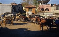 In front of the church of Virgin Mary: the station for the horse-drawn carriages