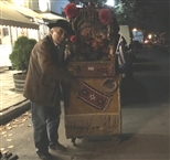 A ‘laternadzis’ with his ‘laterna’ (street organ) in the historic neighborhood of Volos (an October night of 2017)