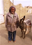 Iran, Yazd: In front of the Cemetery, old man with his donkey (in 2012)